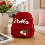 Sac à dos personnalisé en velours côtelé rouge avec prénom Stella et fleur brodée