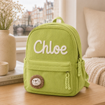 Sac à dos en velours côtelé vert avec prénom Chloé et lion brodé